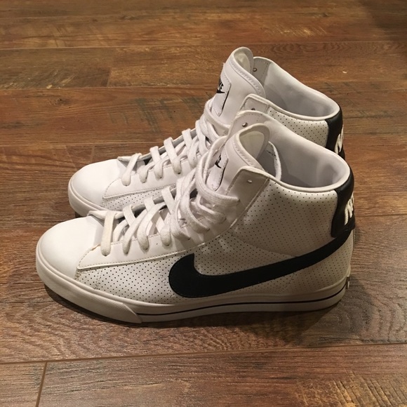 white nike high tops with black swoosh